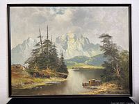 Framed oil painting showing full mountain landscape with trees and river, minor canvas cracks visible.