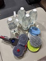 Method shower cleaner refills with refill bottles and spray bottle, Dyson floor cleaner attachment showing from side view with three cleaning pads stacked