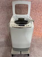 Front view of Panda portable washer with lid open