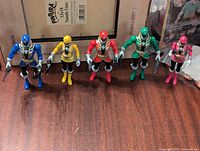 All five Power Rangers figures standing side-by-side displaying size and detail