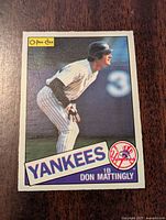 Front of the 1985 O-Pee-Chee Don Mattingly baseball card showing player in batting stance with team and player name.