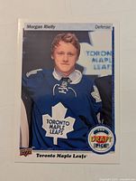 Front of the hockey card showing Morgan Reilly in Toronto Maple Leafs jersey and Top Draft Pick logo.