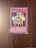 Front view of Yu-Gi-Oh St. Joan card showing artwork, levels and stats.