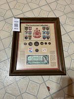 Full view of framed Canadian Centennial collection featuring coins, stamps, banknote, and crests