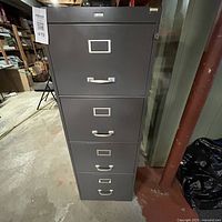 Full view of the gray Cole 4-drawer filing cabinet showing all drawers and exterior.
