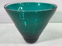 Blue green conical art glass bowl showing full side profile and color gradient from top to bottom.