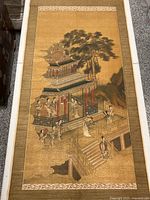 Full view of the Chinese painted scroll laid flat showing pavilion, figures, trees, and clouds.
