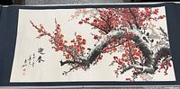 Full view of the scroll showing the plum blossom tree branch with red flowers and the blue border edges.