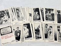 Multiple black and white trading cards showing scenes from Leave It To Beaver characters engaged in various activities and conversation. Cards have captions and quotes on the back.