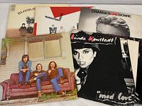 Six vinyl record albums with visible cover art for Blood, Sweat & Tears, Manhattan Transfer, David Bowie, Linda Ronstadt, Crosby, Stills & Nash, and Vikki Carr.