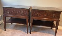 Pair of traditional mahogany nightstands with solid marble tops, showing front view, drawer design, and lower shelf