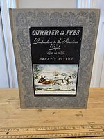 Front cover of the book showing title, author, and winter horse-drawn sleigh illustration.