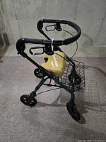 Side angle view of Standor Evolution rollator walker showing padded handles, hand brakes, padded seat, and front wheel.