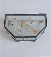 Top view showing pressed flowers inside hinged leaded glass trinket box