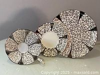Photo of the snack saucer and cup showing the silver lace pattern in good lighting.