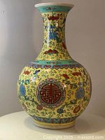 Full front view of the vase showing shape, color, and patterns.