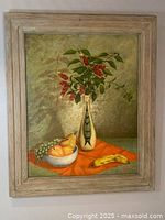 Framed oil on board painting of still life with fruit and vase of flowers, full view.