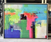 Full view of abstract framed art piece showing colorful composition and signature.