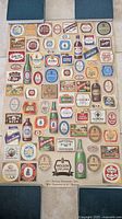 Full view of the 1986 Molson 200th Anniversary poster laid flat showing arranged rectangular grid of vintage beer labels.