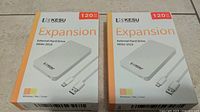 Two boxed, sealed KESU-2519 external hard drives side by side showing front design and capacity.