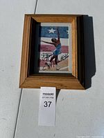 Framed photo of Michelle Kwan figure skating, showcasing her signature and the quote.
