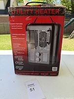 Box showing front and one side of the utility heater with list of features and image of the heater frontside showing control knobs and carry handle