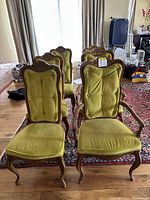 Six chairs in a group shot from front showing upholstery and frame details