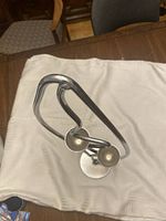 Top view showing two small round cups for tea candles within metal frame.