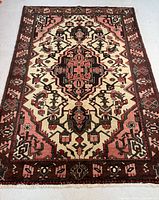 Full view of entire rug showing overall geometric medallion pattern and border
