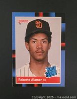 Front of 1988 Roberto Alomar Donruss baseball card showing player image, team cap and uniform, and rookie emblem.