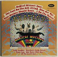 Front cover of The Beatles Magical Mystery Tour album with colorful psychedelic artwork and title.