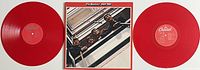 Two red vinyl records and album cover of The Beatles 1962-1966 double LP