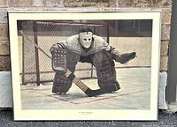 Full view of the framed hockey goalie print illustrating the dressed goalie crouched at a goal crease on ice.