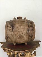 Front side view of the ceramic barrel jug ornament displaying textured detail