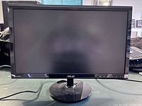 Front view of Asus 21.5 inch monitor powered off, showing screen and stand, with power cable connected.