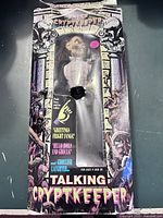 Original box front showing the Cryptkeeper doll inside with promotional text about talking features and phrases.