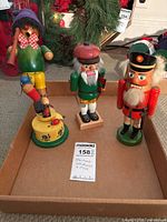 Photo of all three figures: the Pied Piper incense burner and two nutcrackers in a box.