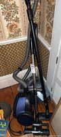 Full view of Kenmore canister vacuum cleaner showing body, hose, wand, and attachments.