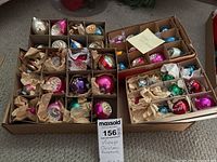 Full lot of three boxes of vintage glass Christmas ornaments with dividers and tissue paper for protection.