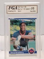 Front side of the 1984 Fleer Darryl Strawberry rookie baseball card with grading label inside protective case.