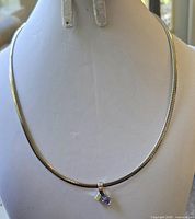 Full view of the 16-inch white gold necklace displayed on a bust, showing the fine chain and pendant.