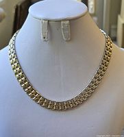 Full view of the vintage gold tone Cora necklace displayed on a white bust.
