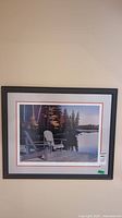 Full view of John Harrington framed limited edition print showing lakeside dock with chairs and fall foliage.