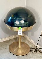 Full view of Apollo 711 turntable with smoked plexiglass dome cover on gold-tone tulip-shaped base, showing the overall design and condition.