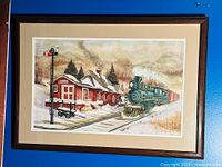 Full view of framed watercolour depicting Bentley Station with steam locomotive in snowy scene.