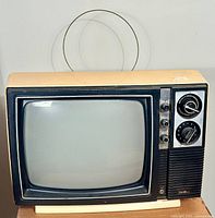 Front view of the vintage Sears TV showing screen, antenna, and controls.