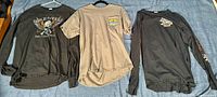 Three vintage Harley-Davidson shirts laid out flat showing front, sleeves, and back