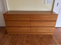 Front view of entire dresser showing six drawers and top scratch