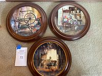 Three W S George special edition plates each with round dark wood frame showing distinct artistic scenes.