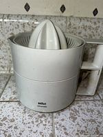 Side view of Braun Citromatic juicer showing the reamer cone and handle.